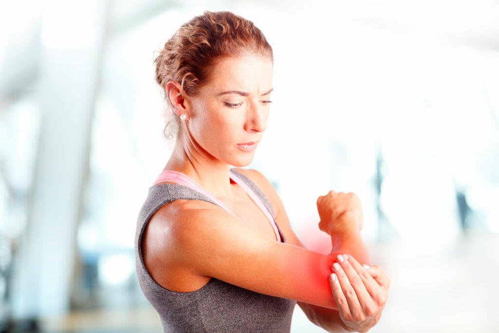 Woman experiencing elbow pain